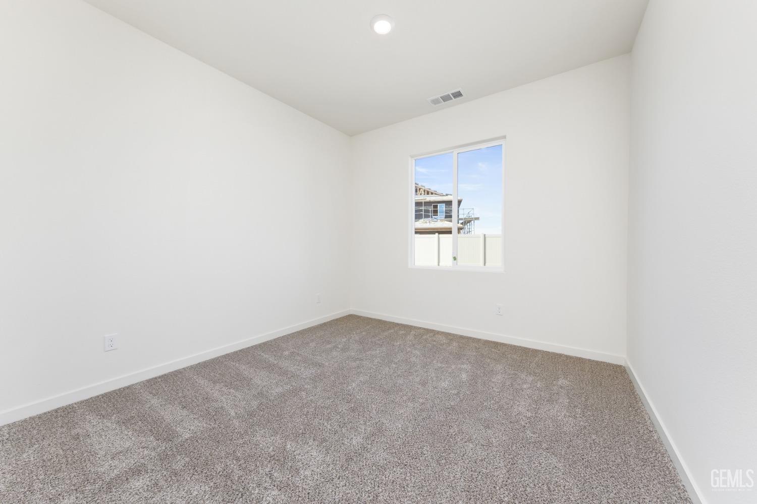 Undisclosed Address Bakersfield, CA 93313 - Photo 4 of 12 an empty room with windows