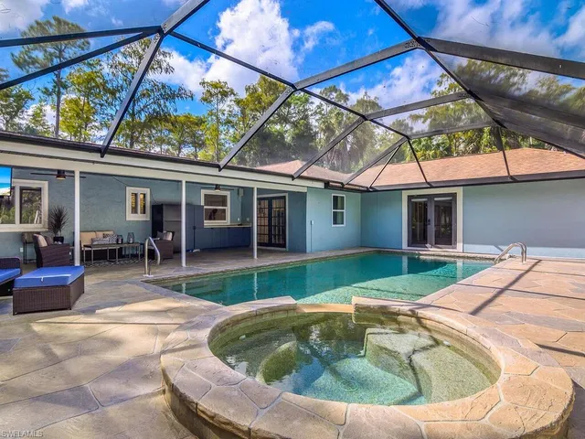 a front view of a house with a yard table and chairs