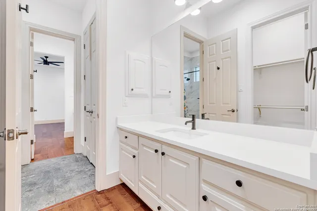 a bathroom with a sink and a mirror