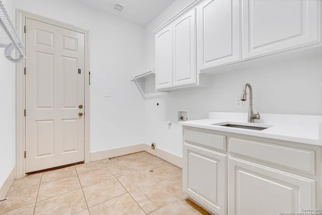 a kitchen with white cabinets