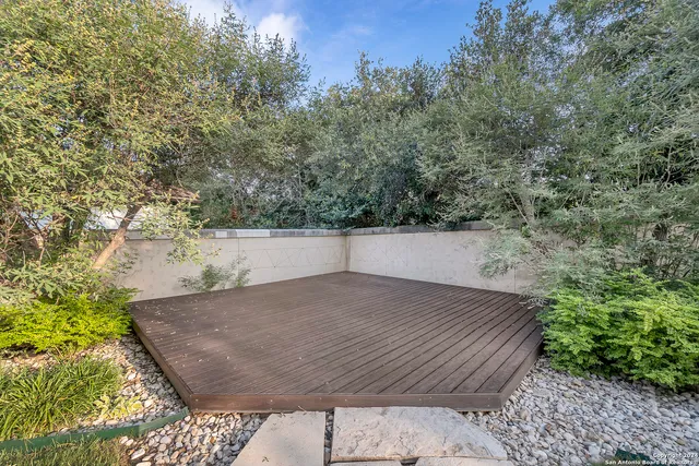 a view of a backyard of the house