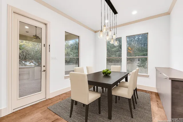 a view of a dining room with furniture window and outside view