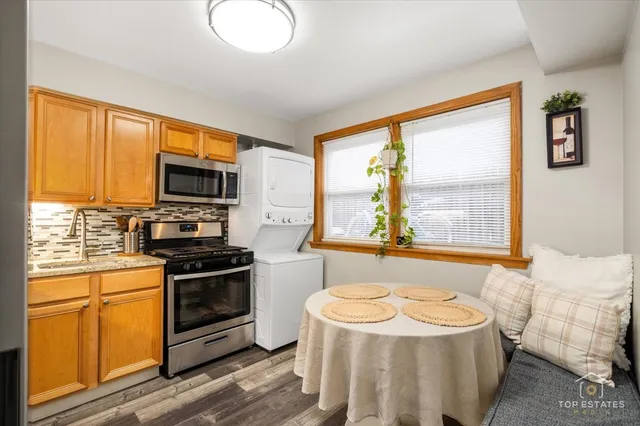 a kitchen with a stove a sink and a microwave