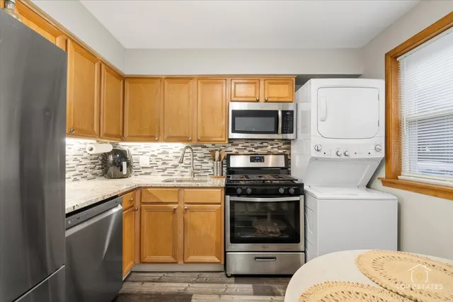 a kitchen with a stove a sink and a microwave