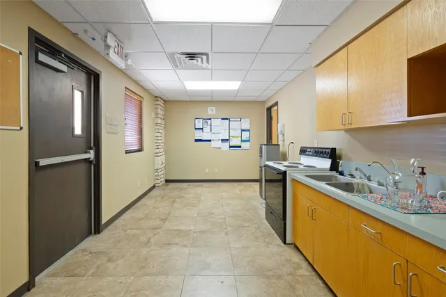 a view of an empty room with a potted plant