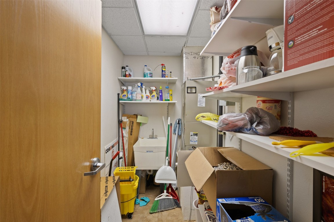 401 Main Street Blanco, TX 78606 - Photo 19 of 36 a room with storage and utility