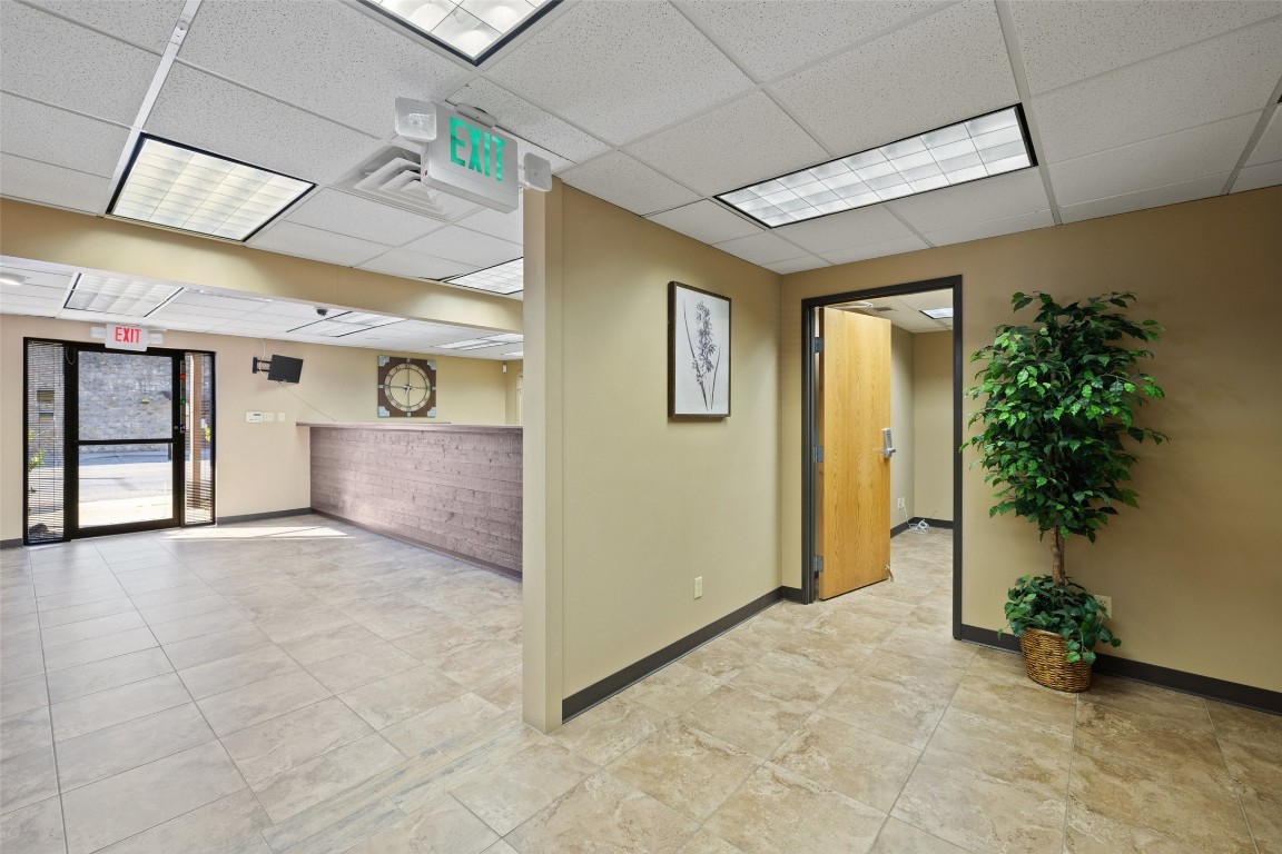 401 Main Street Blanco, TX 78606 - Photo 20 of 36 a view of an empty room with a potted plant
