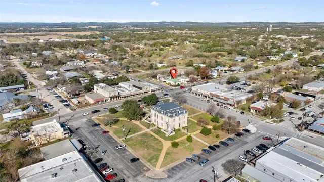 an aerial view of residential building with parking space