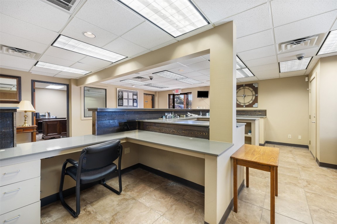 401 Main Street Blanco, TX 78606 - Photo 24 of 36 a kitchen with stainless steel appliances granite countertop a sink and wooden cabinets