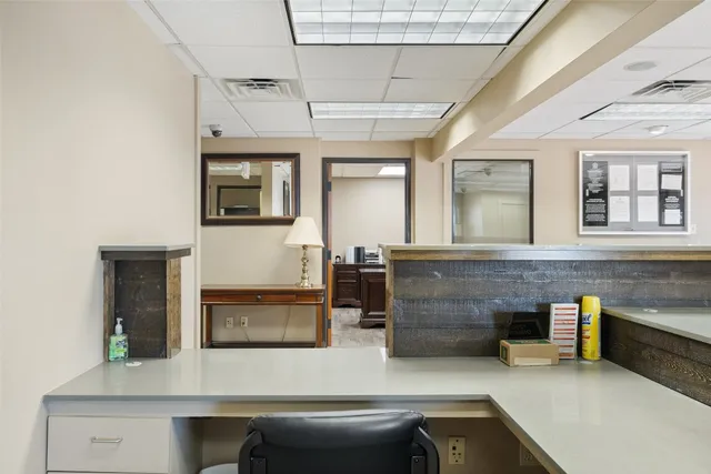 a view of a kitchen with furniture and a window