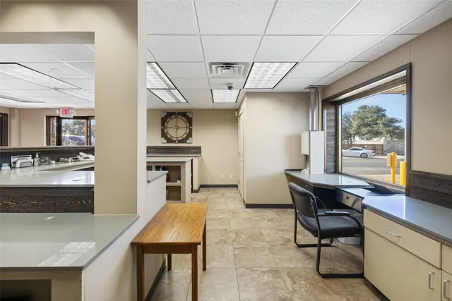 a view of a building with sitting area