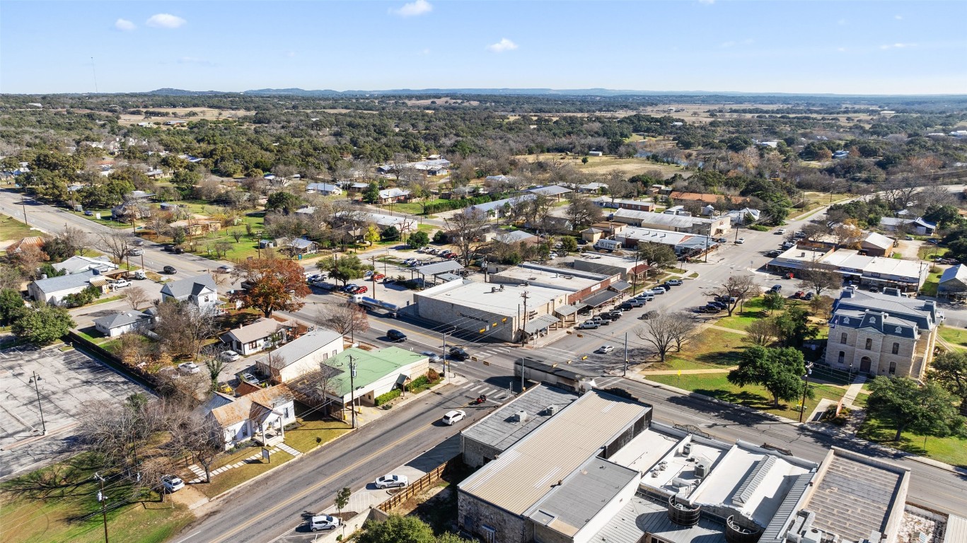 401 Main Street Blanco, TX 78606 - Photo 7 of 36 an aerial view of a city with lots of residential buildings