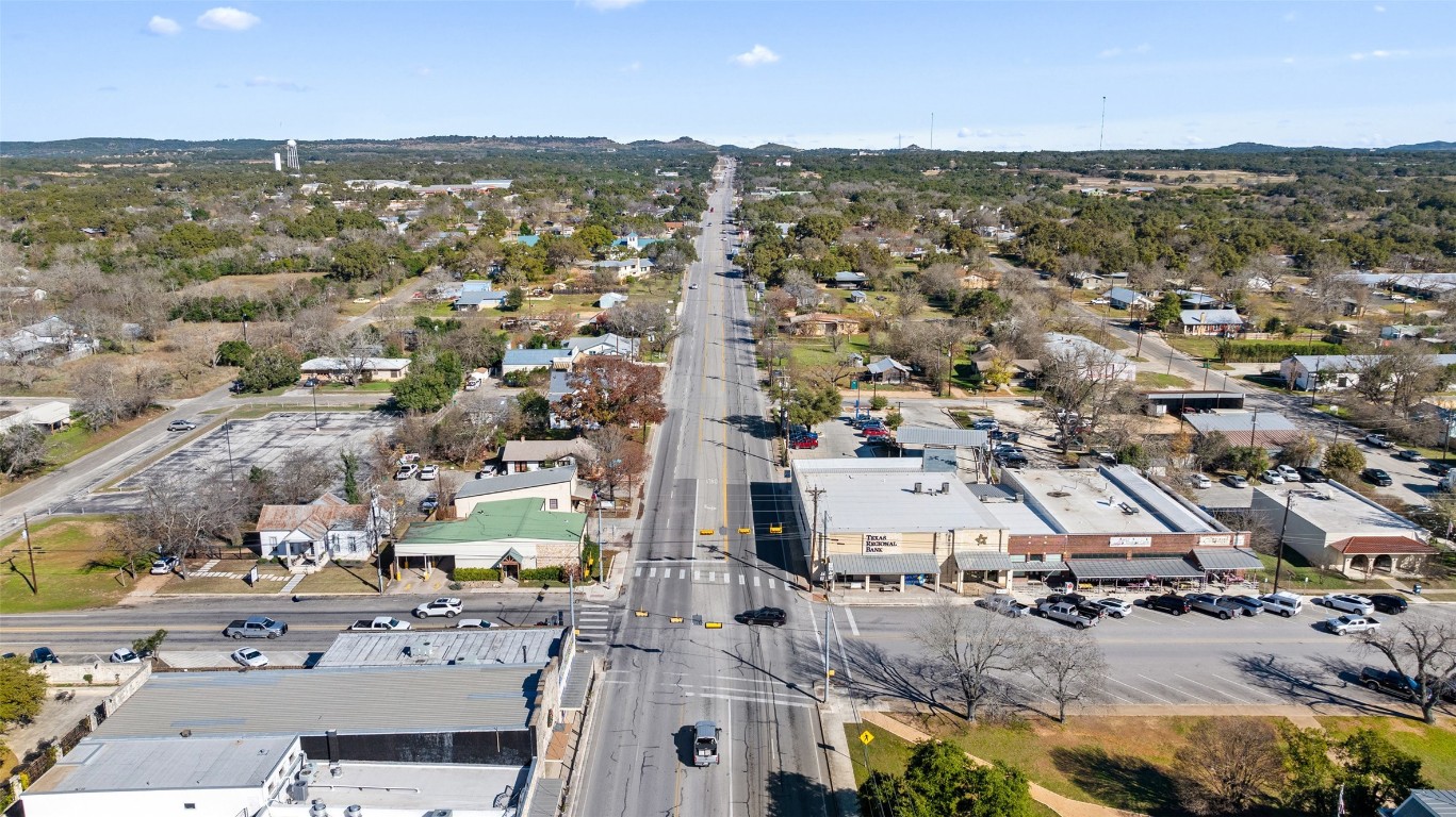 401 Main Street Blanco, TX 78606 - Photo 8 of 36 an aerial view of residential houses with outdoor space