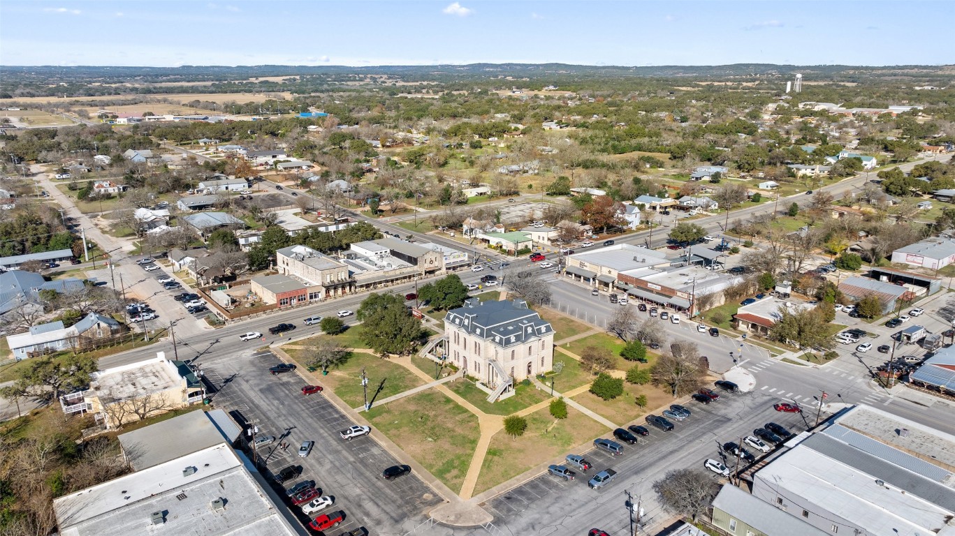 401 Main Street Blanco, TX 78606 - Photo 9 of 36 an aerial view of residential building with parking space