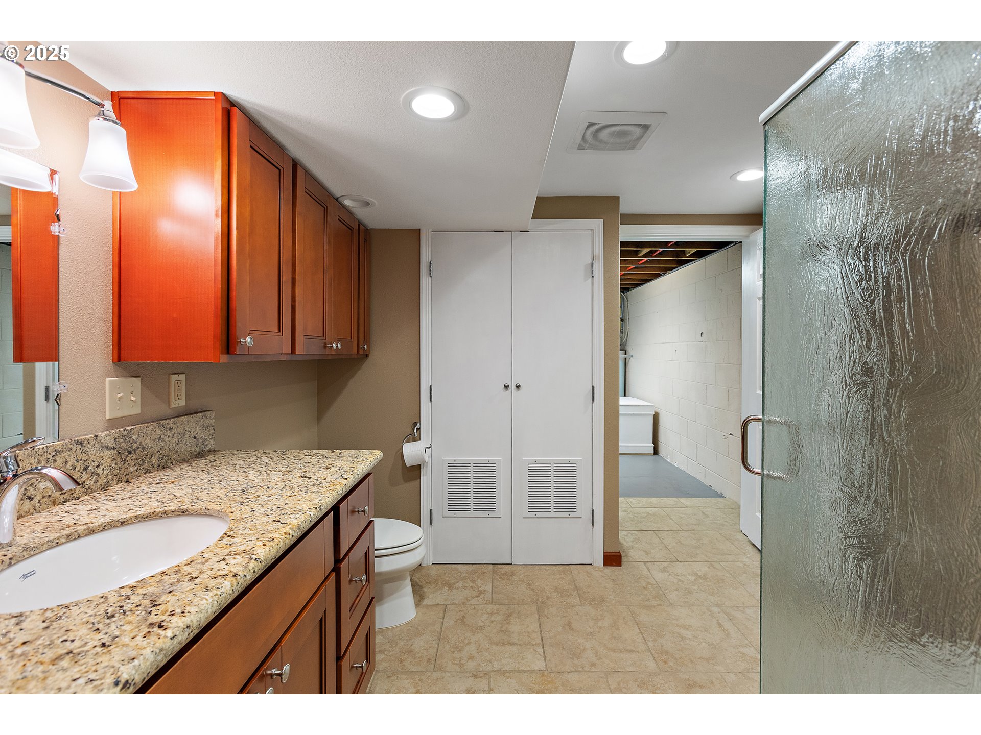 30700 South S Highway Canby, OR 97013 - Photo 21 of 37 a bathroom with a granite countertop sink a mirror and a shower