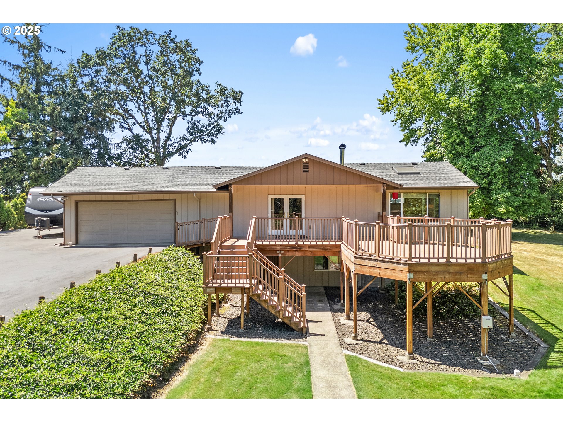30700 South S Highway Canby, OR 97013 - Photo 4 of 37 a front view of a house with a yard table and chairs