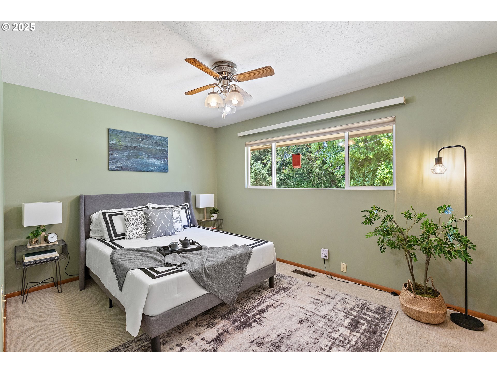 30700 South S Highway Canby, OR 97013 - Photo 9 of 37 a living room with a bed furniture and a potted plant