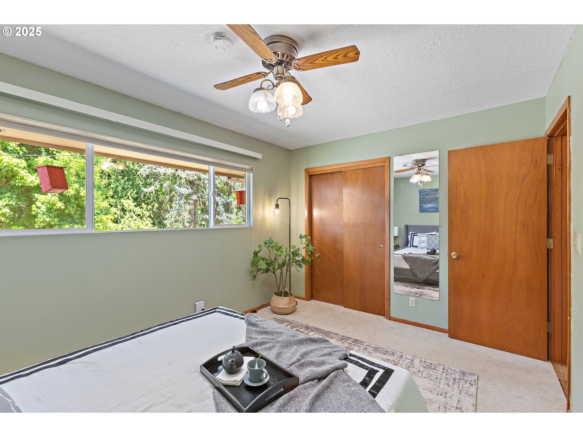 30700 South S Highway Canby, OR 97013 - Photo 10 of 37 a bedroom with a bed and a chandelier