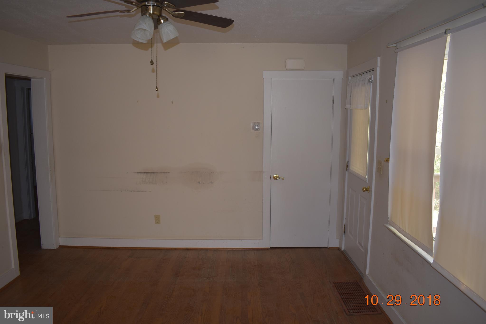 14210 Exline Road Hancock, MD 21750 - Photo 11 of 26 an empty room with a empty space and a ceiling fan