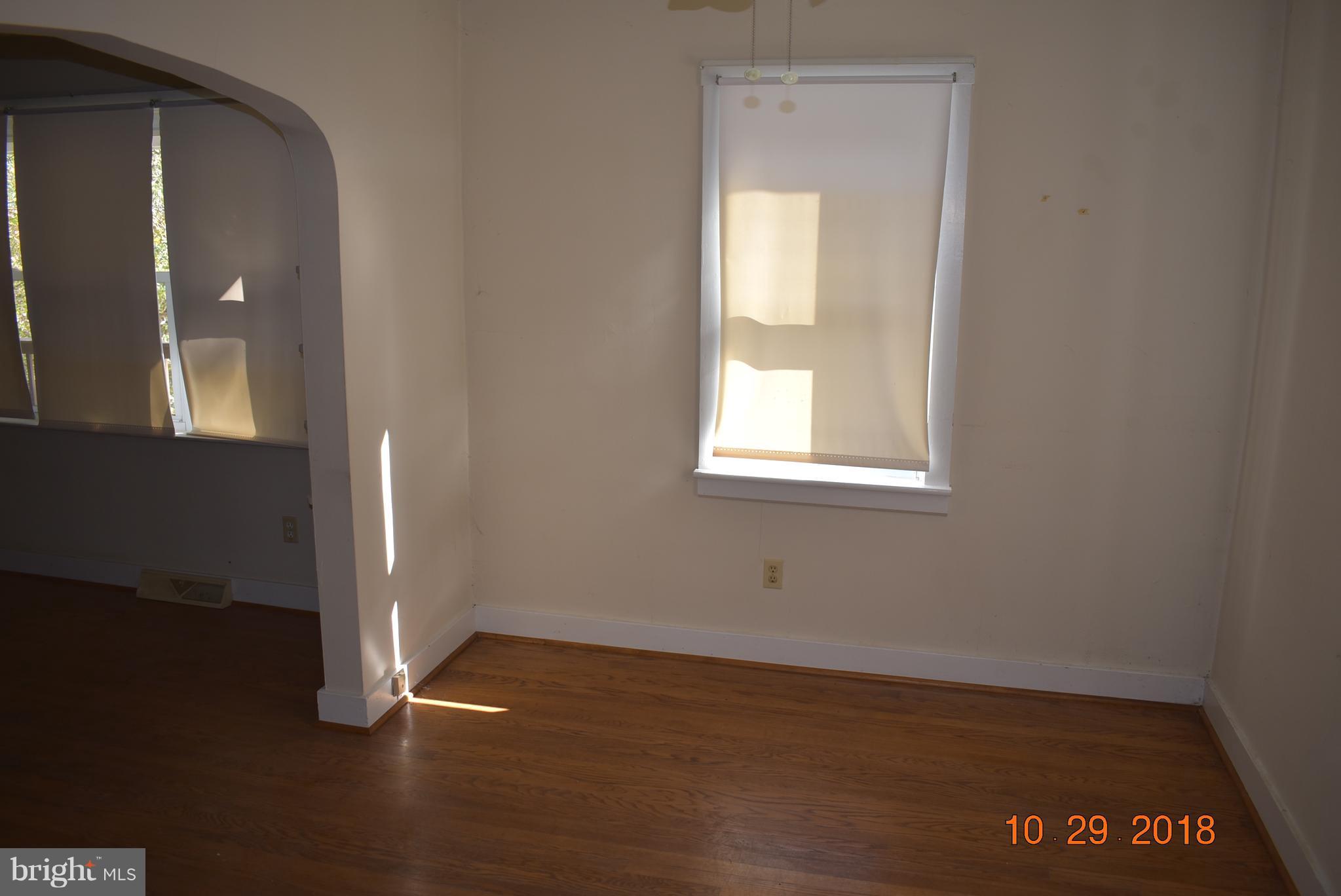 14210 Exline Road Hancock, MD 21750 - Photo 6 of 26 an empty room with wooden floor and windows