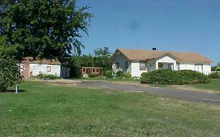 370 Noye Road Tieton, WA 98947 - Photo 2 of 7 a front view of a house with a garden and yard