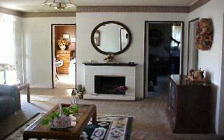 370 Noye Road Tieton, WA 98947 - Photo 6 of 7 a living room with furniture a mirror and a fireplace