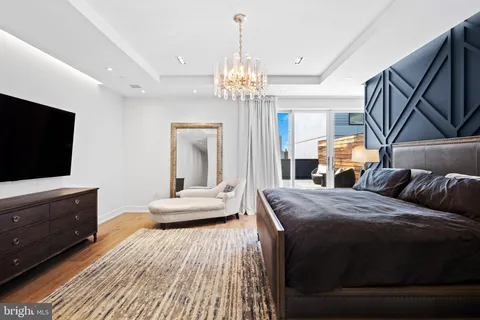 a bedroom with a bed and a television