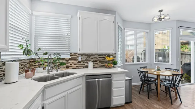 a kitchen with a sink stove and cabinets