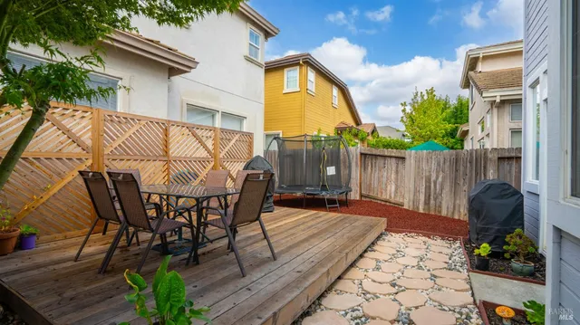a view of a chairs and table in the patio