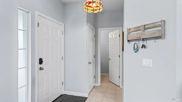 a view of a hallway with bathroom