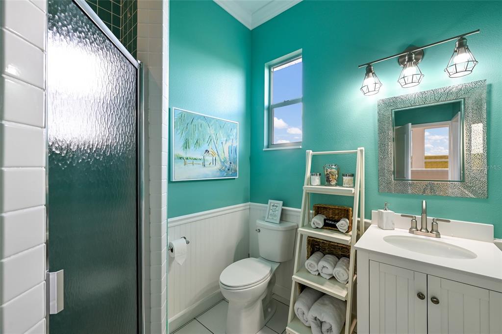 7325 Holly Road Terra Ceia, FL 34250 - Photo 44 of 87 a bathroom with a toilet sink and mirror
