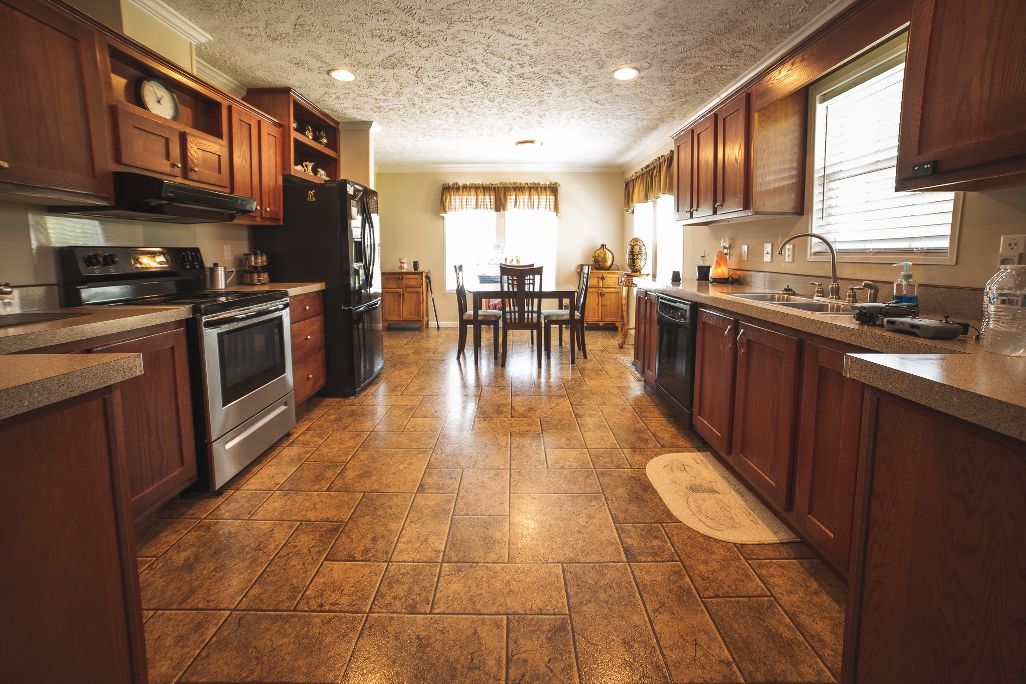 373 Church Road Decherd, TN 37324 - Photo 55 of 65 a kitchen with stainless steel appliances granite countertop a stove a sink a microwave and cabinets
