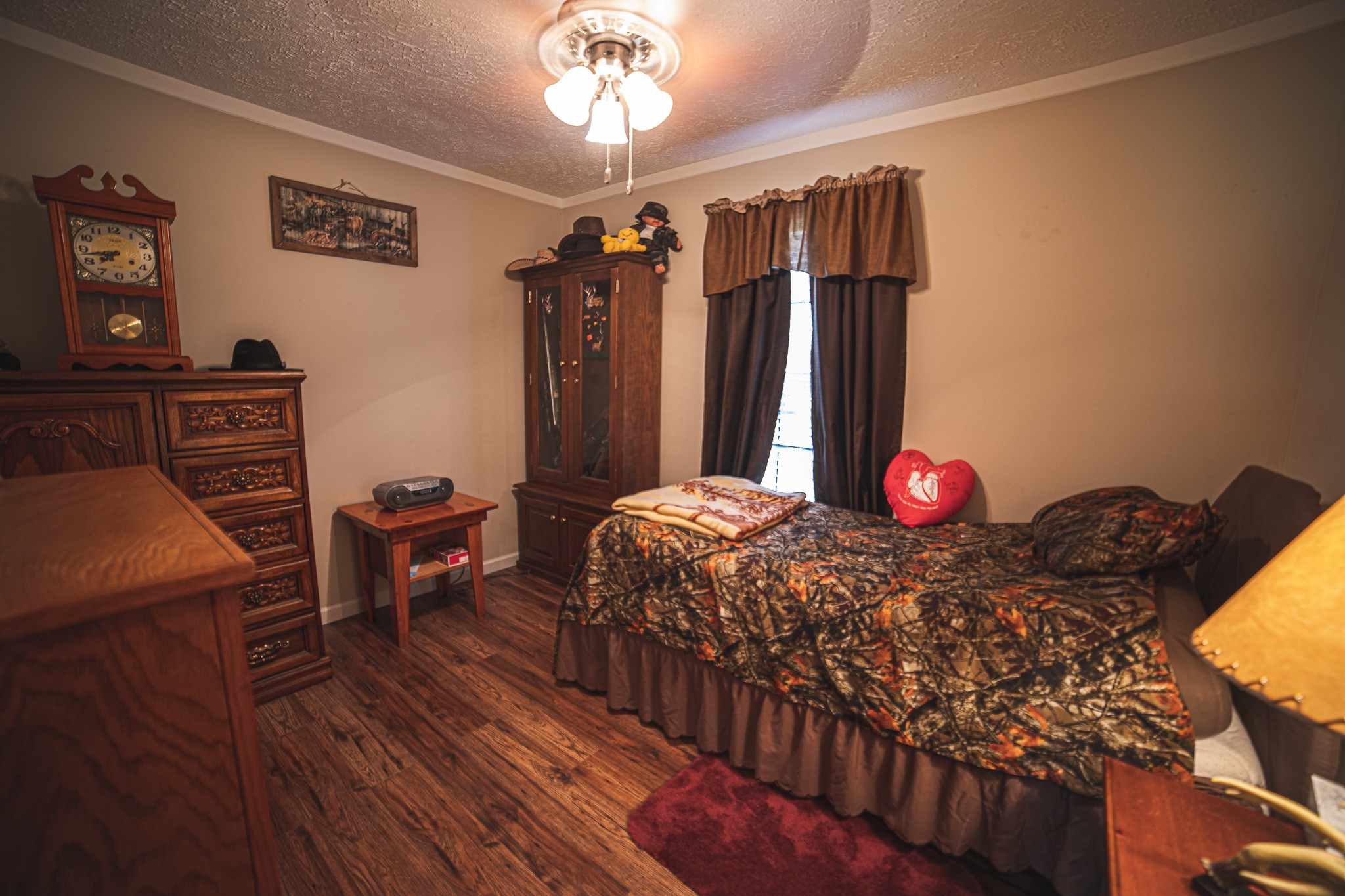 373 Church Road Decherd, TN 37324 - Photo 62 of 65 a bedroom with a bed and a chandelier