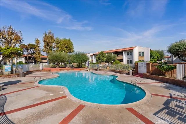 a view of a swimming pool with a patio