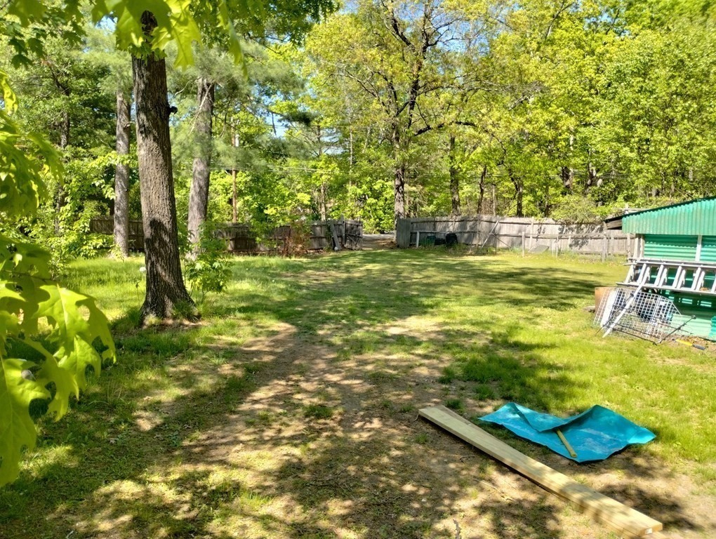 80 Forge Village Road Groton, MA 01450 - Photo 2 of 10 a view of a golf course with trees