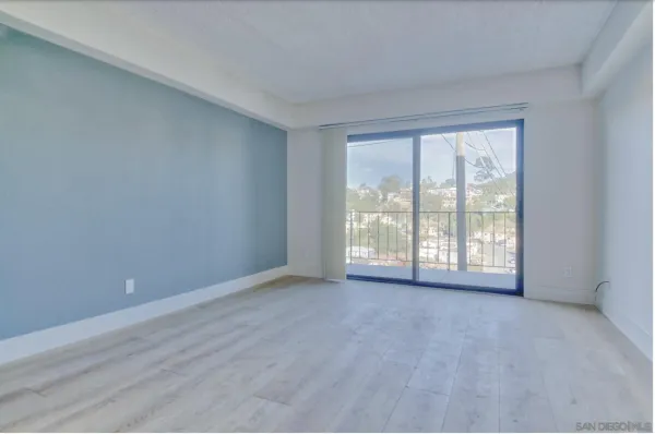 a view of an empty room with a window