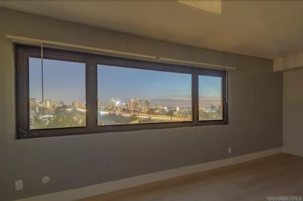 a view of a room that has a large window