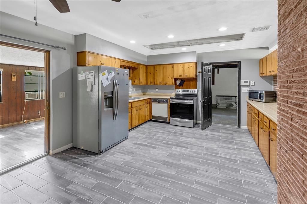 310 Kenmore Road Brandon, FL 33511 - Photo 9 of 33 a kitchen with stainless steel appliances granite countertop a refrigerator and a stove