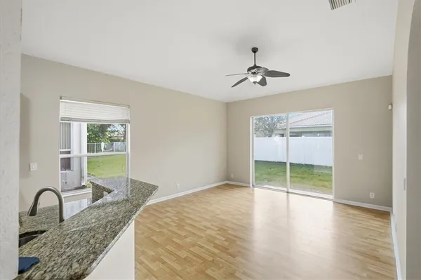 a bedroom with granite countertop a bed and a sink