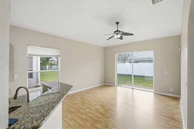 a bedroom with granite countertop a bed and a sink
