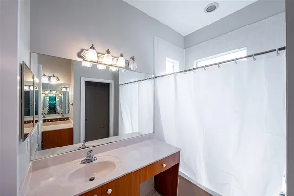 a bathroom with a sink and a mirror
