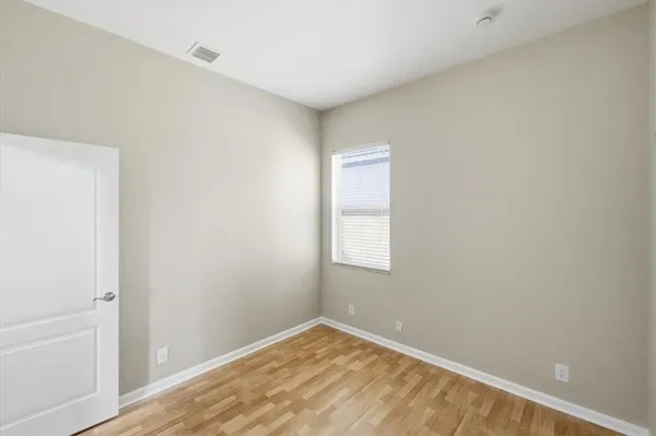 a view of an empty room and window