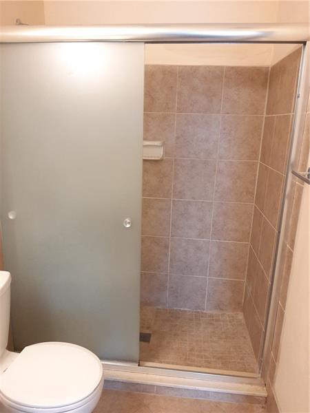 9466 Boca Cove Circle, Unit 310 Boca Raton, FL 33428 - Photo 17 of 22 a bathroom with a shower and a toilet