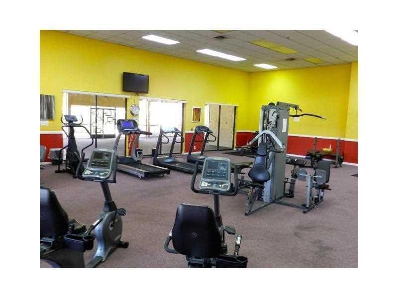 9466 Boca Cove Circle, Unit 310 Boca Raton, FL 33428 - Photo 21 of 22 a room with gym equipment