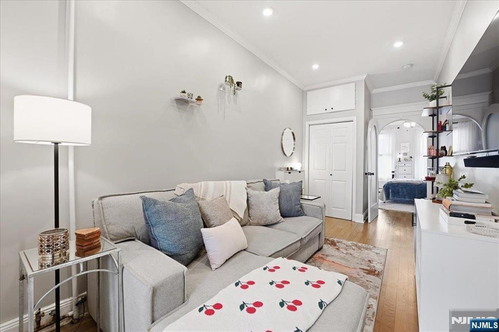 63 Madison Street, Unit 6 Hoboken, NJ 07030 - Photo 2 of 16 a living room with furniture and a lamp