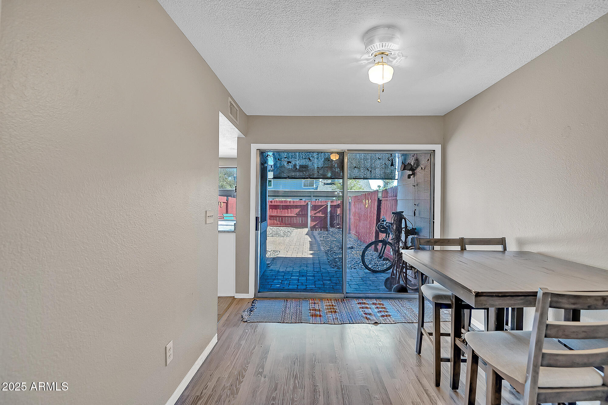 10100 North 89th Avenue, Unit 66 Peoria, AZ 85345 - Photo 16 of 32 Dining looking towards backyard