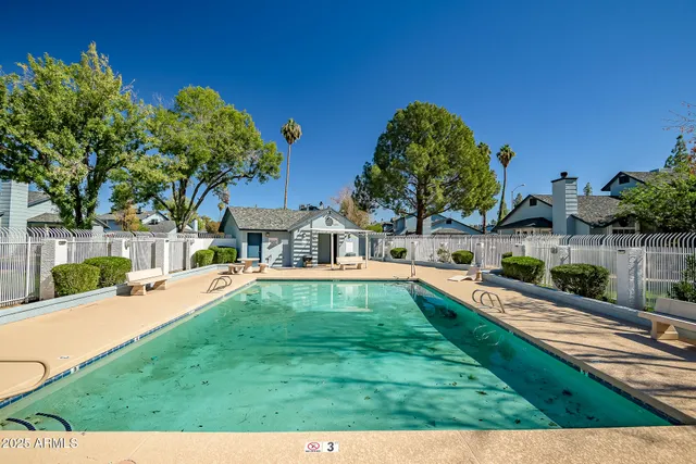 a view of a swimming pool with a patio