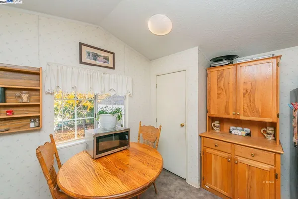 a bedroom with bed and window