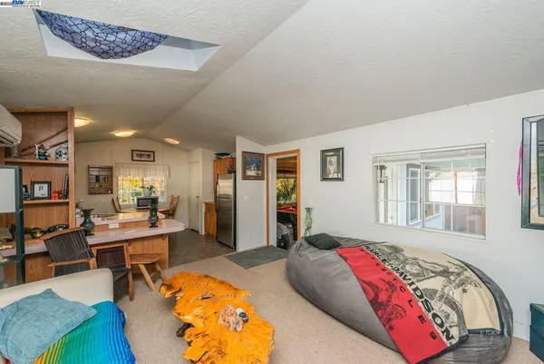 a living room with furniture and a gate