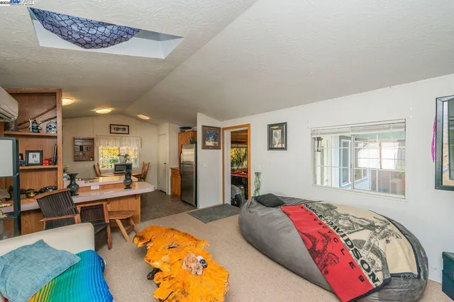 a living room with furniture and a gate